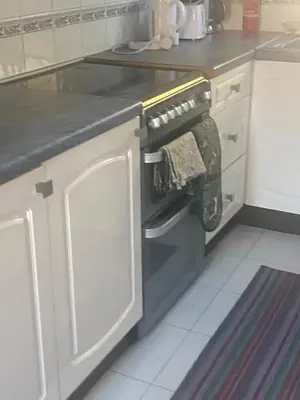 a kitchen with a dish towel hanging from an oven at The Wright 1 bedroom place to stay large drive in East Harling
