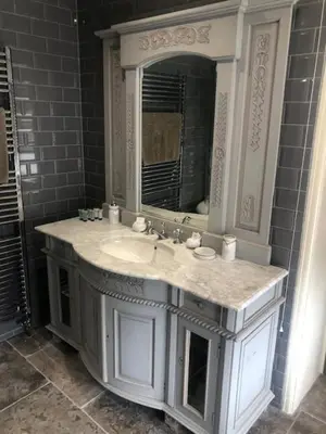 a bathroom with a sink and a mirror at Colchester Boutique Hotel in Colchester