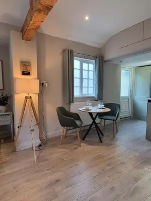 a dining room with a table and chairs at The Studio at Chequers - Newly Renovated Luxury Studio in Brome