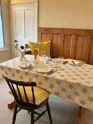 a table with a table cloth with stars on it at Quiet getaway for 2 near Bury St Edmunds in Honington