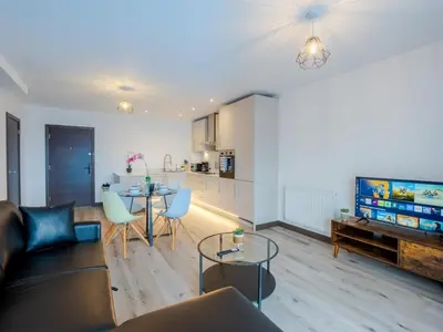 a living room with a couch and a table at Cosy 2-Bed Next to Harlow Town in Harlow
