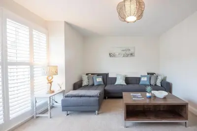a living room with a couch and a table at North Cottage, Aldeburgh in Aldeburgh