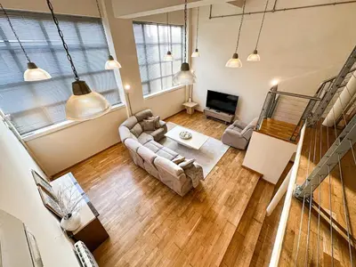 an overhead view of a living room with a couch at Portman Business & Leisure Duplex in Ipswich