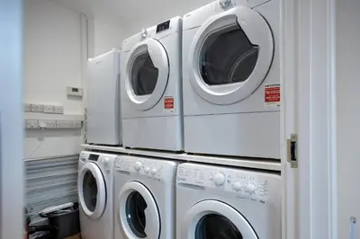 two washer and dryers stacked on top of each other at Shrub End Lodge - Colchester in Lexden