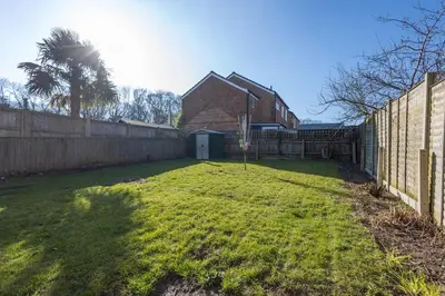 a yard with a fence and a house at Sizewell - Lincoln - Contractor Accommodation in Saxmundham