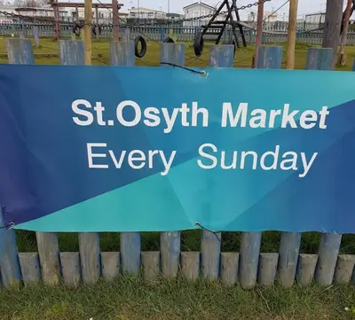 a blue sign for st oswald market every sunday at Tracis home from home in Jaywick Sands
