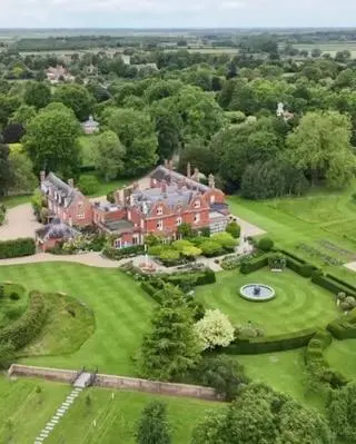 an aerial view of a large house with a green yard at Cosy Rural Retreat Perfect for Families and Pets in Tuddenham