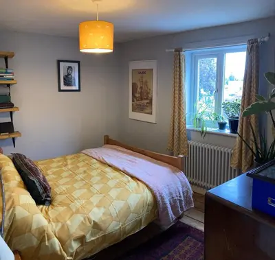 a bedroom with a bed and a window at Charming Cambridgeshire Home in Ely