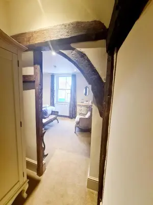 a view of a living room with an archway at The Harvard Inn in Stock