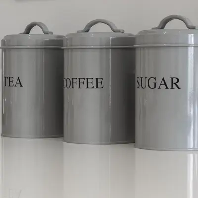 a group of three metal buckets on a shelf at Citystay Living - Vesta Apartments in Cambridge