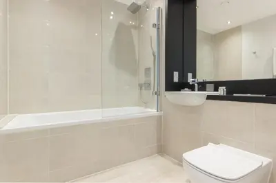 a bathroom with a shower and a toilet and a sink at Citystay Living - Vesta Apartments in Cambridge