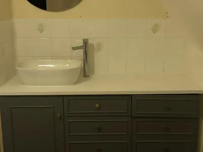a bathroom with a sink and a faucet at Isleham River Lodge in Isleham
