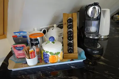 a shelf with a coffee maker and a blender at Oakwrights in Terling