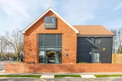a store front of a brick building with a window at Mermaid, Ipswich by Marston's Inns in Ipswich