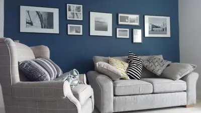 a living room with two chairs and a couch at Great Northern Road Apartment in Cambridge