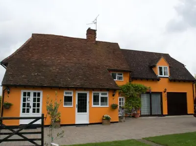 a orange house with a brown roof at Woodview B Colchester in Birch