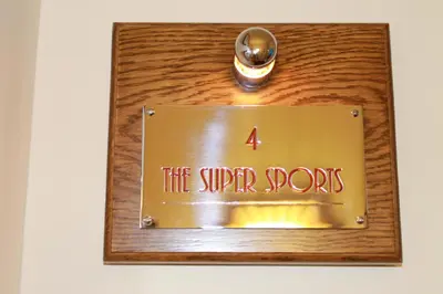 a sign that reads fire super ports on a wooden table at The PitStop in Bishops Stortford