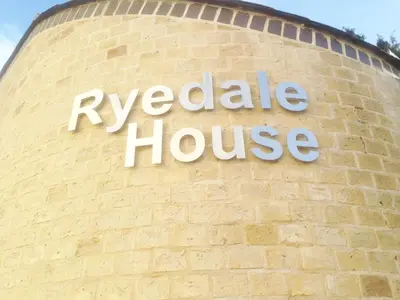 a sign on the side of a brick building at Citystay Living - The Dales in Cambridge