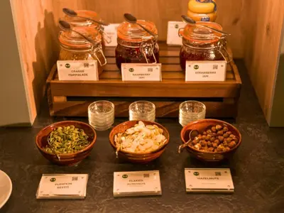 a table with bowls of food and jars of food at B&B HOTEL Ipswich in Ipswich