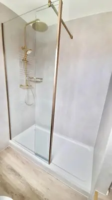 a shower with a glass enclosure in a bathroom at Hotel Coco in Felixstowe