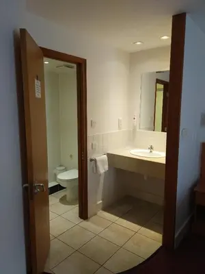 a bathroom with a sink and a toilet at Ramada Cambridge in Cambridge