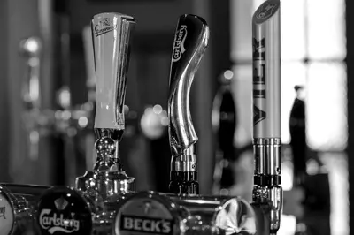 two drinking glasses sitting on top of a counter at The Crown Inn Hotel in Long Melford