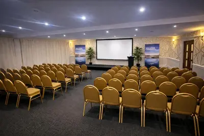 a conference room with chairs and a projection screen at The Park Hotel - Sure Hotel Collection by Best Western in Diss