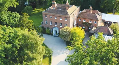 an aerial view of a large brick house with trees at Mulberry House in Ongar