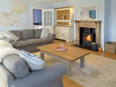 a living room with a couch and a coffee table at Granary Cottage in Bentley