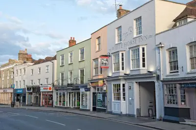 a row of buildings on a city street at White Horse in Maldon