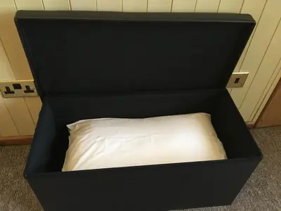 a black box with a white pillow in it at Old Field Barn Luxury B&B in Attleborough