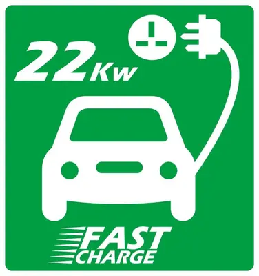 a green sign with a car on a fast charger at Old Field Barn Luxury B&B in Attleborough