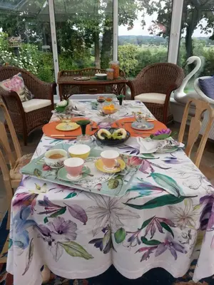 a table with a table cloth with food on it at Folly Studio Bed and Breakfast in Bungay