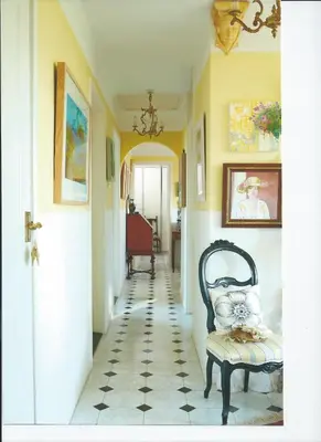 a hallway with a chair in a room at Folly Studio Bed and Breakfast in Bungay