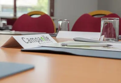a table with a pen and a sign on it at Campanile Hotel - Basildon - East of London in Basildon