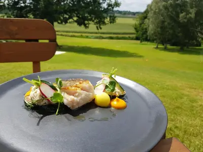 a plate of food sitting on top of a table at Marquis Suffolk in Ipswich