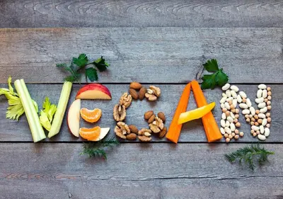 a group of vegetables and nuts on a wooden table at Rettendon Lodge in Battlesbridge
