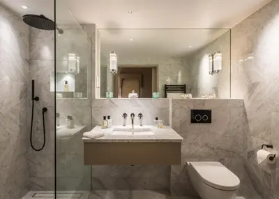 a bathroom with a sink and a toilet and a shower at Cambridge Country Cottages in Cambridge