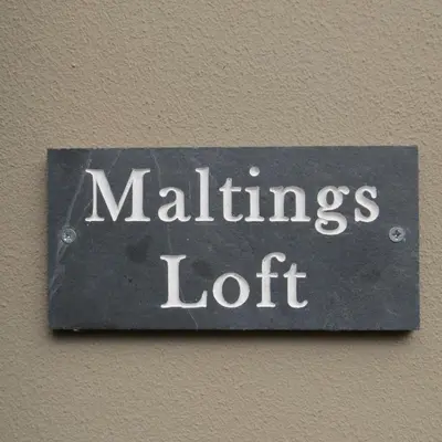 a sign on a wall with the words maligning loft at Maltings Loft in Hepworth