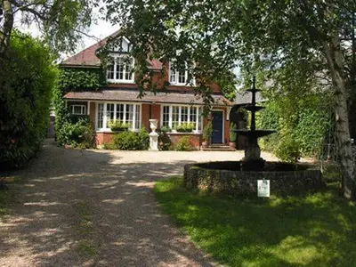 a house with a fountain in front of it at Frasers in Battlesbridge