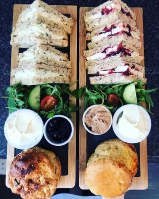 a plate of food with different types of bread and vegetables at Frasers in Battlesbridge