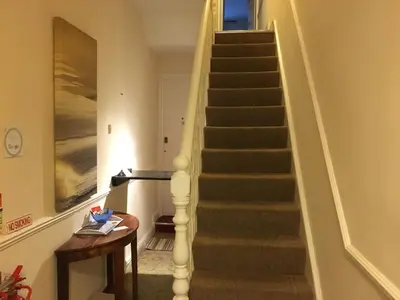 a staircase in a home with a stair case at CARIS Guest House in Southend-on-Sea