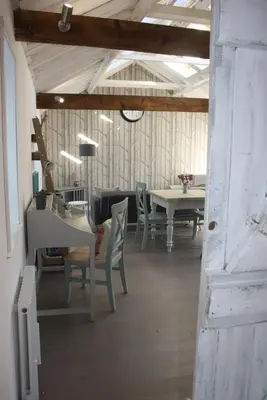 a dining room with a table and chairs at Crafts Hill Barn in Cambridge