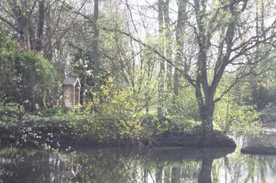 a bird house in the middle of a river at Crafts Hill Barn in Cambridge
