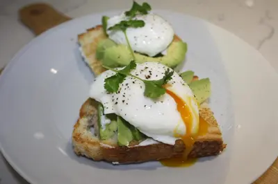a white plate with an egg on a piece of toast at Crafts Hill Barn in Cambridge