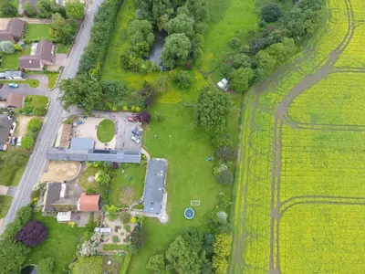 an overhead view of a yard with houses and trees at Crafts Hill Barn in Cambridge