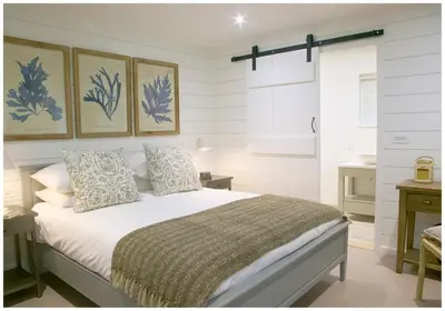 a bedroom with a bed in a room at The Three Hills in Bartlow