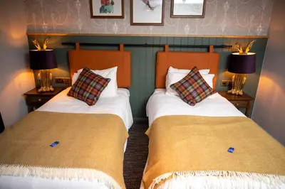 two beds sitting next to each other in a room at Green Man by Chef & Brewer Collection in Harlow