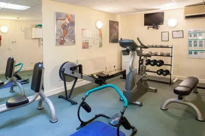 a gym with several exercise equipment in a room at Holiday Inn Ipswich Orwell by IHG in Ipswich
