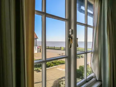 a window view of the beach from a room at Ogilvie Lodge Apartment in Thorpeness